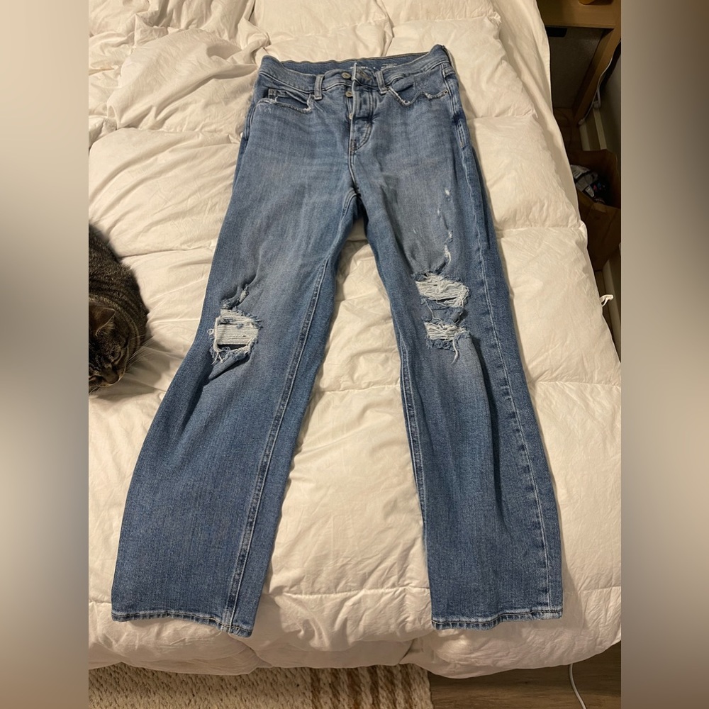 High-waisted distressed denim jeans